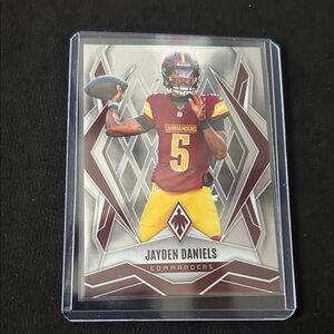 Panini Maroon and Yellow Jayden Daniels Commanders Football Card
